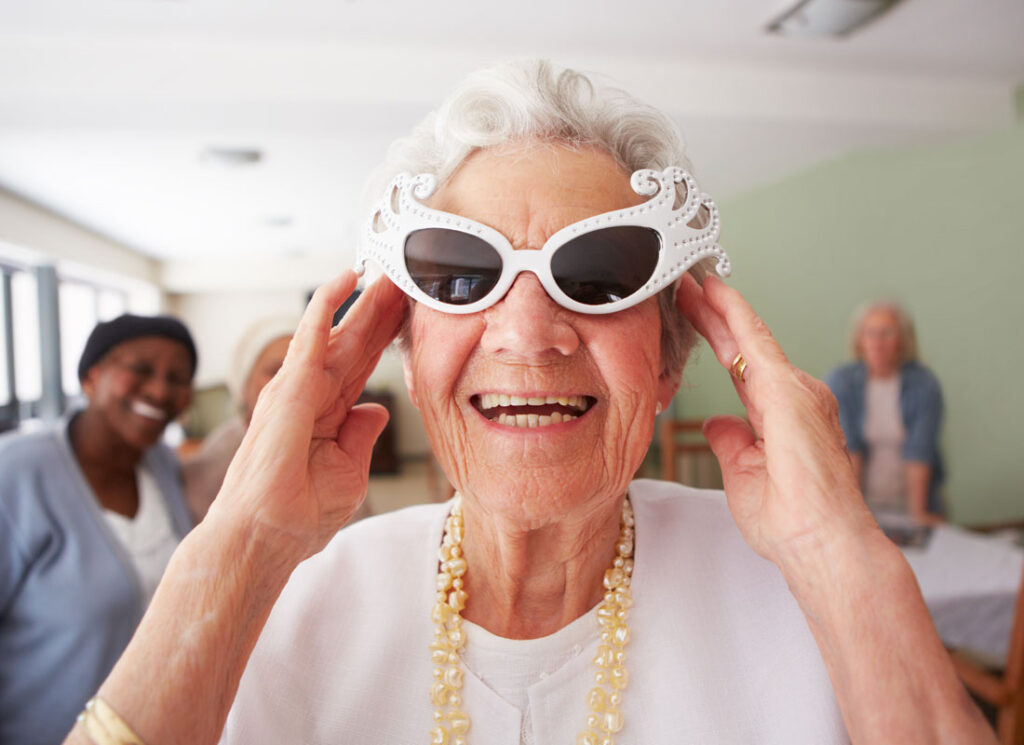 Senior woman with funky white sunglasses