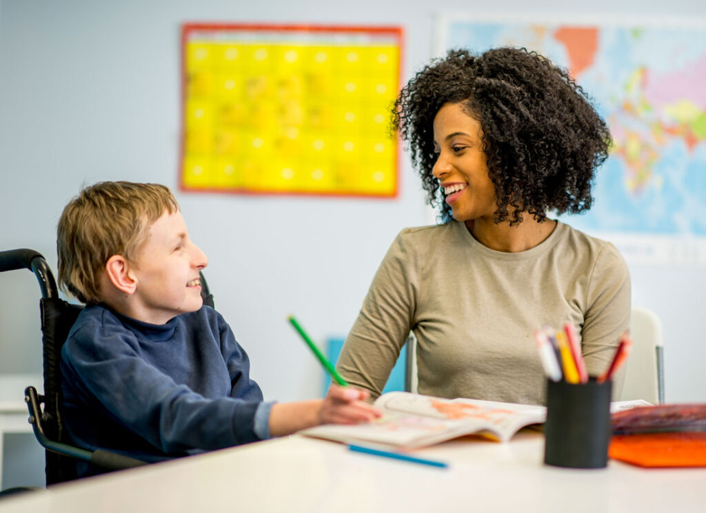 Woman chatting with member in wheelchair