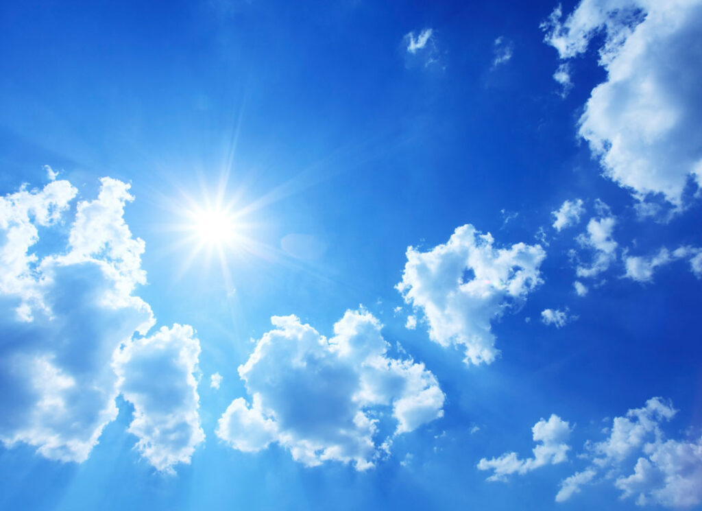 blue sky with clouds and sun