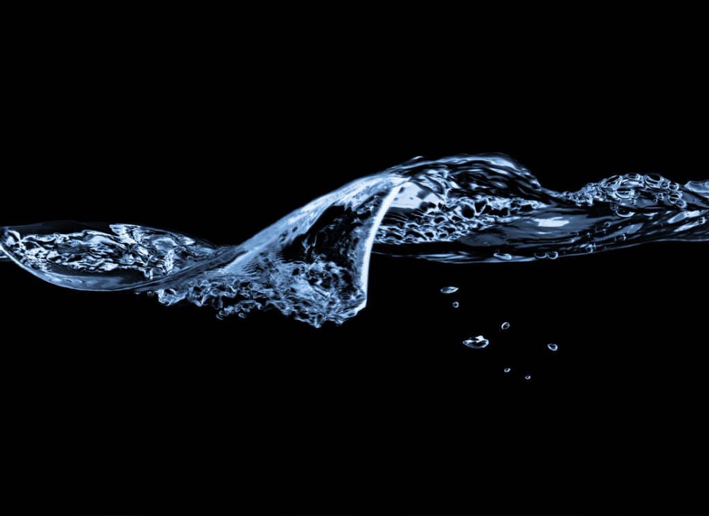 water thrown across black background