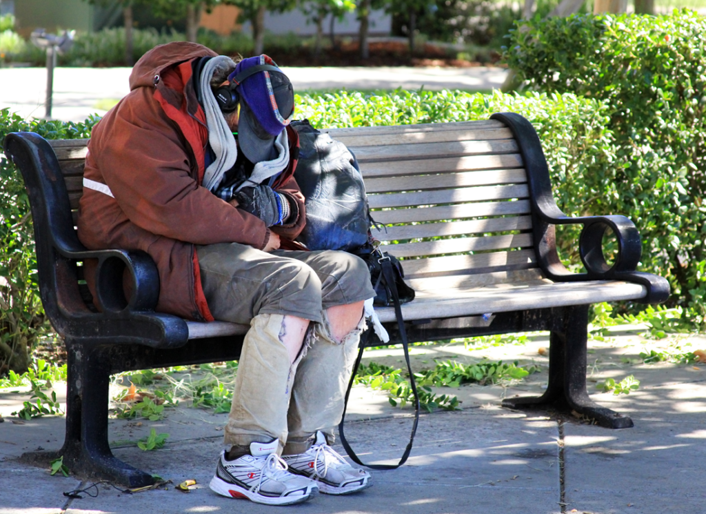 Homeless man on bench